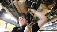 Keeping hands busy with automotive work helps disabled Marine heal