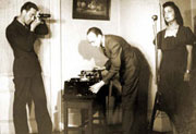 Photo of Kennedy setting up equipment.