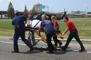 photo of EMTs and patient
