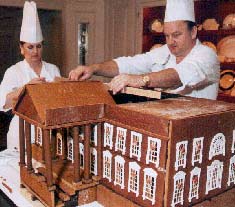 Executive pastry chefs during Bill Clinton's tenure prepare a gingerbread White House