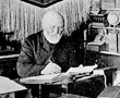 Scottish missionary William Duncan, founder of Metlakatla Christian Mission at his desk, Metlakatla, Alaska, ca. 1903