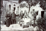 A group of men and women in a courtyard