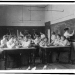 Group of young women performing atmospheric pressure experiments while studying science in normal school, Washington, D.C. (1899?)