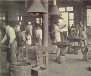 African-American men in working in blacksmith workshop, illustration from 'My Larger Education'.