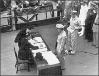 The Japanese envoys sign the Instrument of Surrender on board the U.S.S. Missouri
