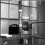 A drinking fountain labeled with a sign 'White.'