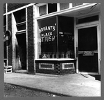 A fish restaurant for Negroes in the section of the city
where cotton hoers are recruited, includes a sign: 'Bryant's Place
Hot Fish for Colored.'
