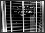 Sign on a restaurant, with a sign: 'We Cater to White Trade
only.'