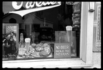 Sign in a beer parlor window, reading 'No Beer sold to
Indians.'