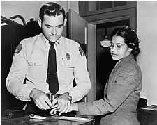 Mrs. Rosa Parks being fingerprinted in Montgomery, Alabama, 1956.