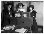 Three suffragists casting votes in New York City(?)