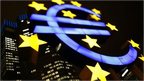 An illuminated euro sign 