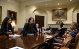 President Obama Talks with Staff Following a Meeting