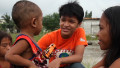 Filipino street kid helps others