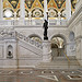 [Great Hall. View of grand staircase and bronze statue of female figure on newel post holding a torch of electric light, with bust of George Washington at left. Library of Congress Thomas Jefferson Building, Washington, D.C.] (LOC)