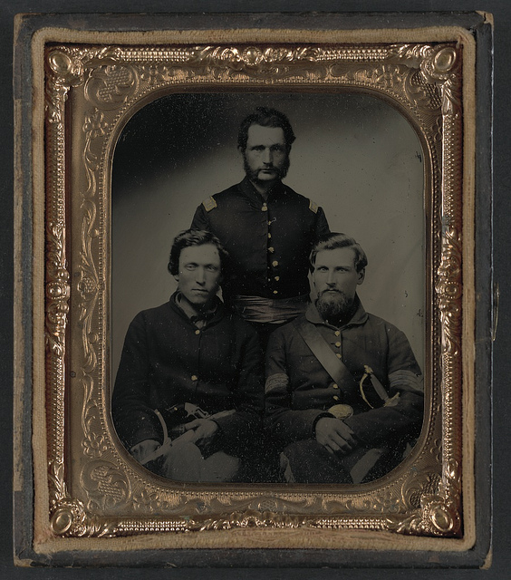 [Three unidentified soldiers, probably of Company B, 23rd Ohio Infantry Regiment, with revolvers and sword] (LOC)