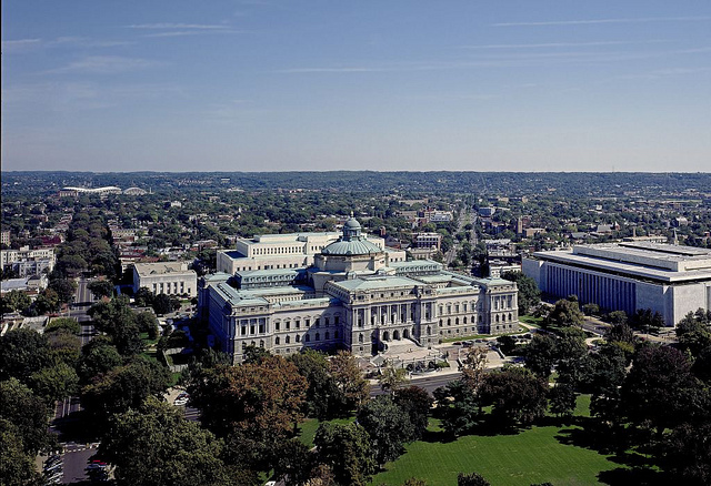 [Aerial view showing the Library of Congress Thomas Jefferson Building, with East Capitol Street on the left and the James Madison Building on the right, Washington, D.C.] (LOC)