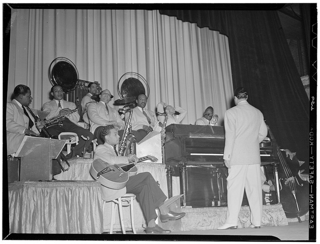 [Portrait of Duke Ellington, Junior Raglin, Juan Tizol, Barney Bigard, Ben Webster, Harry Carney, Rex William Stewart, and Sonny Greer, Howard Theater(?), Washington, D.C., between 1938 and 1948] (LOC)