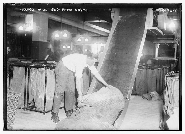 Taking mail bag from chute  (LOC)