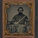 [Unidentified soldier in Union infantry sergeant's uniform holding a model 1840 non-comissioned officer's sword next to table with Company H, 6th Regiment Hardee hat on top] (LOC)