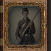 [Unidentified soldier in Union uniform with musket, revolver, and Bowie knife] (LOC)