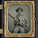 [Unidentified soldier in Confederate pullover hunting-style shirt with dark military-type trim with double barrel shotgun, revolver, and side knife] (LOC)