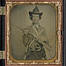 [Unidentified cavalry soldier in Confederate uniform with slant breech sharps carbine, two knives, and two revolvers] (LOC)