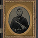 [Unidentified soldier in Confederate uniform with revolver] (LOC)