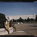 A soldier and a woman in a park, with the Old [Russell] Senate Office Building behind them, Washington, D.C.  (LOC)