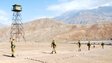 Tajik border guards set out to patrol the border with Afghanistan