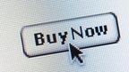 Computer screen shot of a mouse cursor pointing to a 'Buy Now' button 