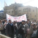 Photo: Protesters march after Friday prayers in Amman.