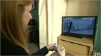 Woman playing on a games console