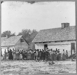 [Large group of slaves(?) standing in front of buildings on Smith's Plantation, Beaufort, South Carolina]