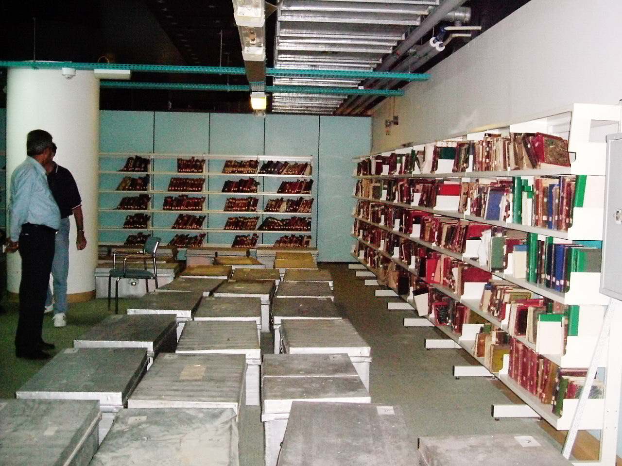 Aluminum boxes and shelved manuscripts in the bomb shelter