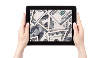 Tablet with money on screen 
