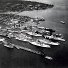 Photo: Puget Sound Navy Yard, Bremerton, Washington, USS Lexington (CV 2), five battleships and a cruiser of the fleet docked at the Navy Yard in 1936.  USS Kearsarge is in the left foreground.   NHHC Photograph, NH 71604.