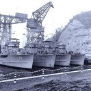 Photo: Korean War Minesweeping.  Four U.S. Navy minesweepers (AMS) tied up at Yokosuka, Japan, following mine clearance activities off Korea. Original photo is dated 30 November 1950.
These four ships, all units of Mine Division 31, are (from left to right):
USS Merganser (AMS-26);
USS Osprey (AMS-28);
USS Chatterer (AMS-40) and
USS Mockingbird (AMS-27).
Ship in the extreme left background is USS Wantuck (APD-125).  Official U.S. Navy Photograph, now in the collections of the National Archives, 80-G-424597.