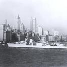 Photo: USS Louisville (CA-28).  Steams past Battery Park, at the southern tip of Manhattan Island, New York City, in 1934.   NHHC Photograph Collection, NH 51905.