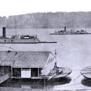 Photo: "City" Class ironclad gunboats.   Off Cairo, Illinois, in 1863, with barges moored in the foreground.  These ships are (from left to right):  USS Baron de Kalb (1862-1863);   USS Cincinnati (1862-1865) and USS Mound City (1862-1865).  Boats are tied astern of Baron de Kalb and Cincinnati.  NHHC Photograph Collection, NH 56663.