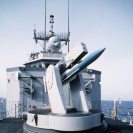 Photo: DN-ST-88-09837

Close-up view of a test missile in the launcher aboard the guided missile frigate USS NICHOLAS (FFG-47).  The missile, which is loaded with electronics, provides data to fire control systems technicians by reporting on the missile launching system.  The ship is taking part in Earnest Will, a convoy mission in which reflagged Kuwaiti tankers are escorted through waters of the Gulf by U.S. naval ships. Film
