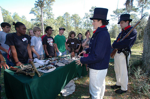Juliann and Matthew Krogh, members of the Coast Guard Historic Ship’s Company, give a living history presentation to Franklin County, Fla., middle school students recently at historic Fort Gadsden on the Apalachicola National Forest. (U.S. Forest Service Photo/Susan Blake)