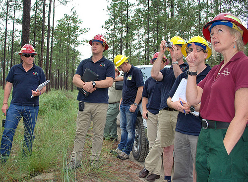 Debbie Casto, Forest Service fire management officer for the National Forests in Florida, discusses the precautions taken before conducting a prescribed burn near threatened and endangered species sites on the Apalachicola National Forest. The forest is home to several endangered species such as the red-cockaded woodpecker. (Forest Service photo by Susan Blake)
