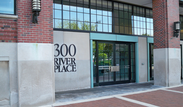 Building facade and front door of 300 River Place in Detroit