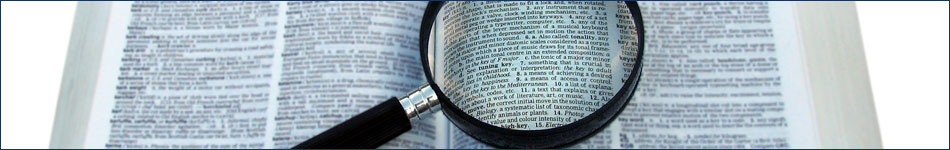Picture of a magnifier and book.