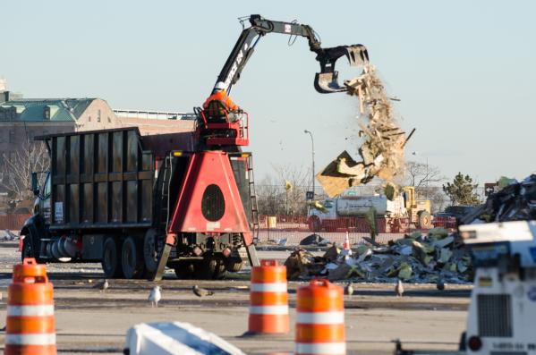 Queens, N.Y., Jan. 18, 2013 -- Debris from Hurricane Sandy is processed at the Jacob Riis Park where the U.S. Army Corps of Engineers works to clean and sort it into piles for recycling. Trash separated from the debris is put into trucks to be hauled to landfills.