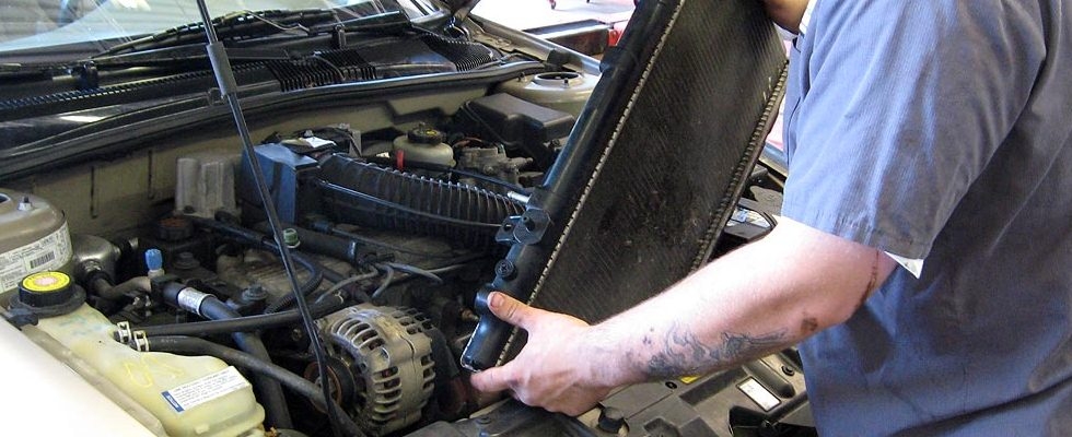 Photo of a mechanic repairing a vehicle