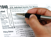 Man filling out tax form