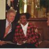 President Clinton puts his arm around adopted child, Charday Mays