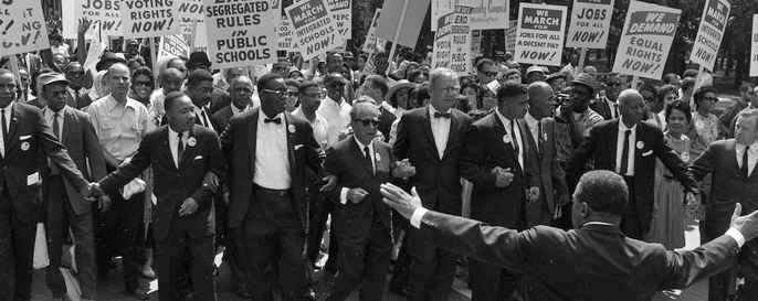 Martin Luther King, Jr. and civil rights demonstrators march together
